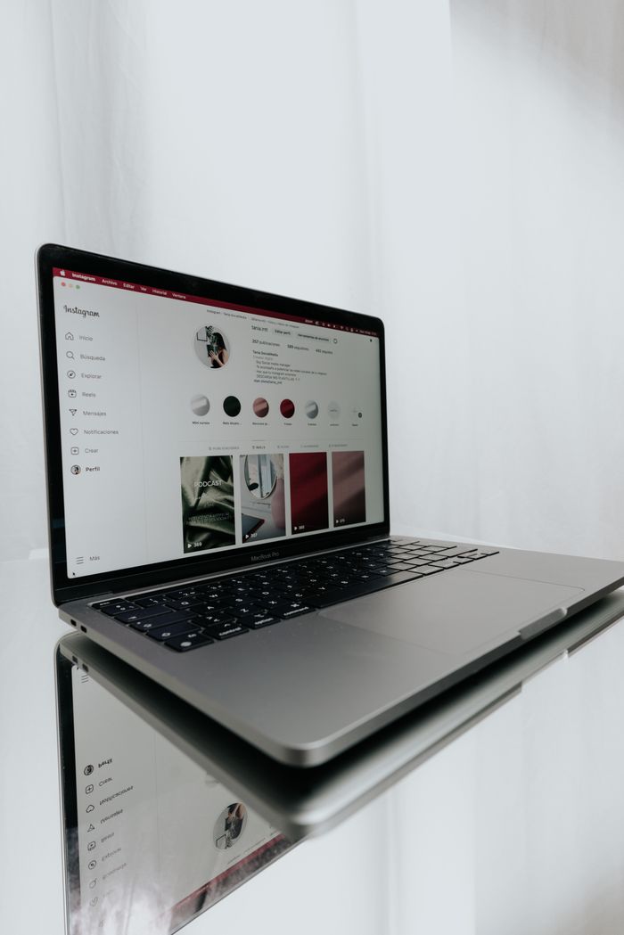creative-01 Sleek laptop displaying an Instagram profile, showcasing modern technology and online connectivity.